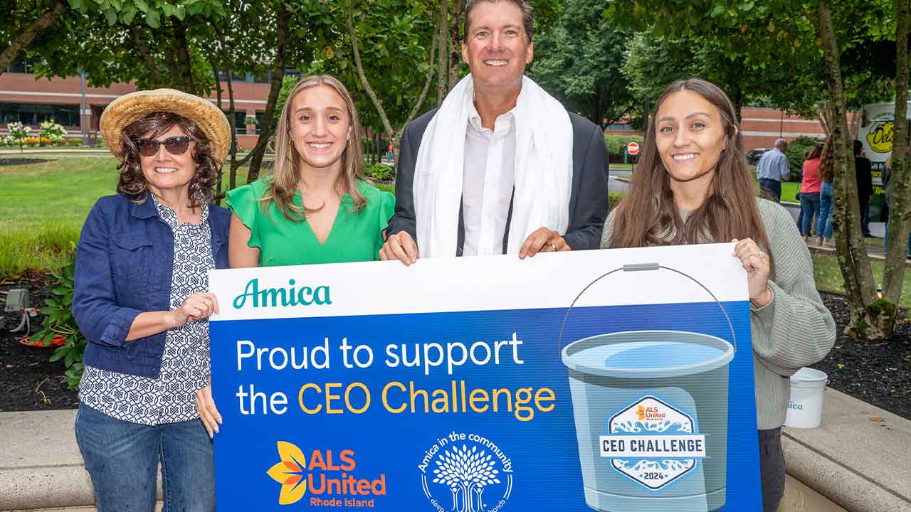 President and CEO Ted Shallcross and three other Amica employees hold sign saying Proud to Support the CEO Challenge