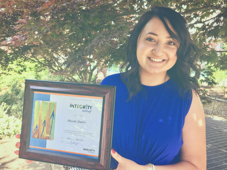 Nicole proudly displaying her Amica achievement award.