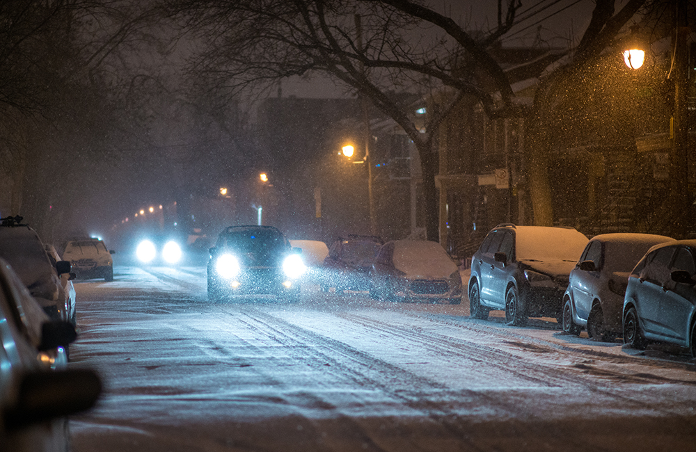 Cars driving on snowy road at night: Amica offers to tips to prepare for cold weather driving