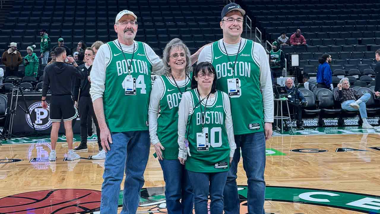 Bullock family at halfcourt during Celtics Bucks game