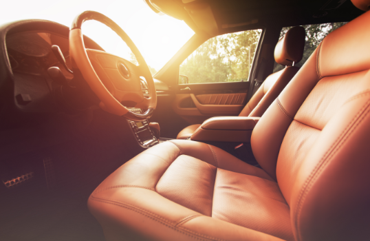 Interior view of luxury car with leather seats: prestige rental coverage