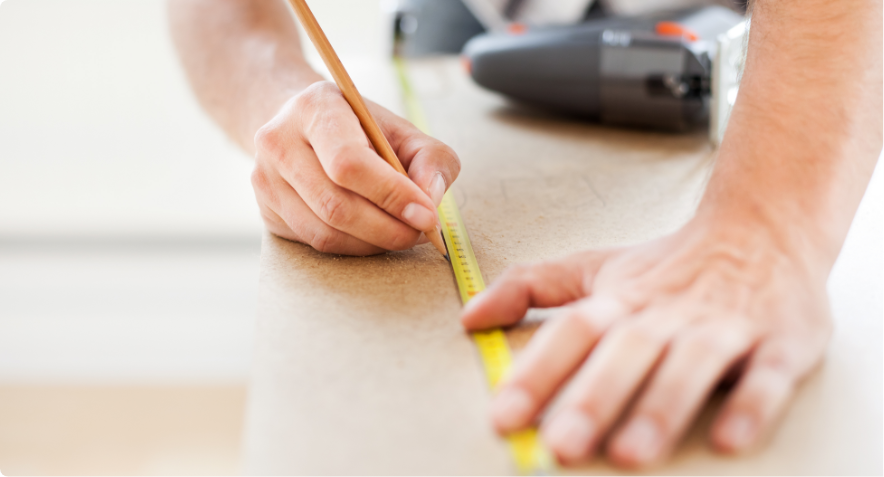 Contractor Connection: Let us help you find a contractor: close up of man’s hands holding pencil and measuring tape
