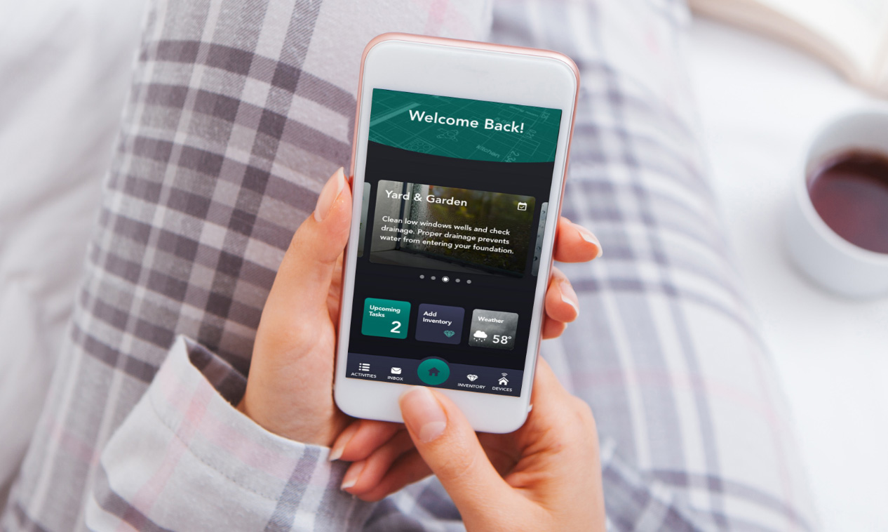 A phone with the Home Check by Amica mobile app on it. 